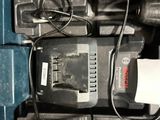 an image of a corded drill in a tool box