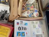 many different types of stamps in a box on the floor