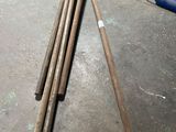 several pieces of wood sitting on top of a floor next to a chair