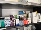 a shelf with many different types of medical supplies on it