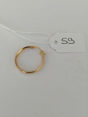 a gold ring on a white background with a price tag