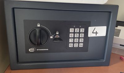 a safe box on a desk in a room