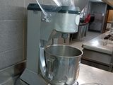 a mixer sitting on a counter in a kitchen