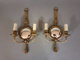 pair of antique brass wall sconces with mirrors and tassels
