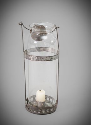 an old fashioned glass lantern with a candle inside of it