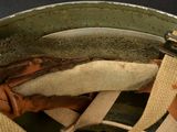 a close up of a helmet with a strap on it