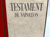 a close up of a book on a white surface with a red cover