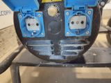 a picture of a close up of a blue and black machine
