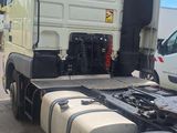 a large white truck that is parked in a lot