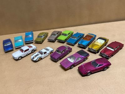 a lot of toy cars that are on the table