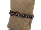 an image of a pillow with a bracelet on it