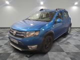 a picture of a blue dacia parked on a checkered floor