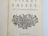 an open book with a black and white image of a coat of arms