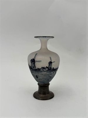 a white vase with a blue and white design on it