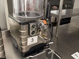 a machine that is sitting on a counter in a kitchen
