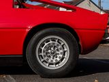 a red car that is parked in a parking lot