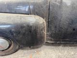 a close up of a car ' s front fender and side fender