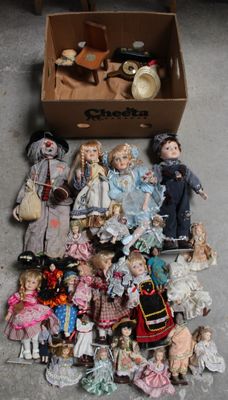 a lot of dolls in a box on the floor