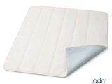 a close up of a mattress pad on a white surface