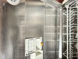 a small refrigerator that has a bunch of dishes inside of it