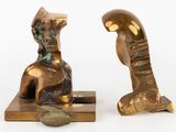 pair of bronze sculptures of a man and a woman on a marble base