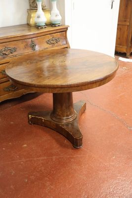 a wooden table and a dresser in a room