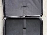 a black case that has a laptop inside of it