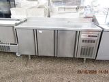 a large stainless steel counter with a bunch of items on it