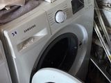 a washing machine and a dryer sitting next to each other