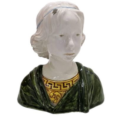 a figurine of a woman wearing a green dress