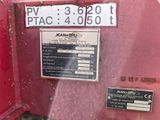 a sign on the back of a red tractor