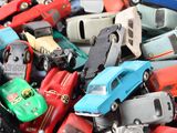 a lot of toy cars that are in a pile