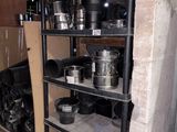 pots and pans on a shelf in a room