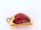 an image of a red glass heart shaped pendant on a white surface