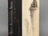 an old book with a drawing of a woman sitting on top of a tree