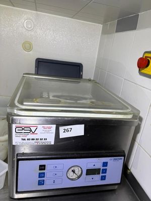 an image of a kitchen with a washer and a sink