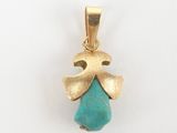 a close up of a gold pendant with a turquoise stone