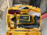 a yellow tool case with tools in it on the floor