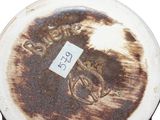 a close up of a coffee cup with a sticker on it