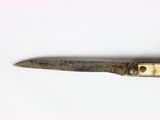an old pair of scissors on a white surface