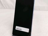 the back of a black cell phone with a barcode on it