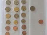 a lot of coins in a plastic bag on the table
