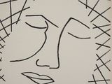 un dessin représentant le visage d'une femme d'où partent des lignes