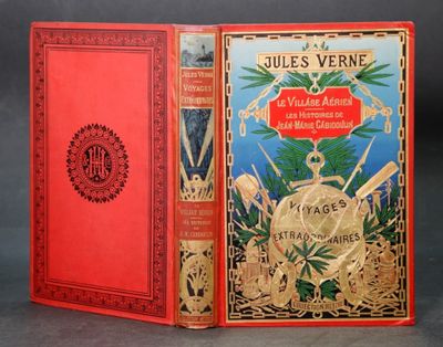 un vieux livre rouge avec une couverture dorée sur laquelle figure une horloge dorée