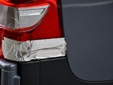 a close up of a car ' s tail light with tin foil on it