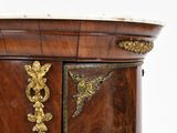 a wooden cabinet with a marble top and gold accents