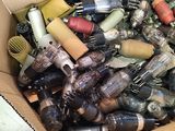 a cardboard box filled with assorted items on the floor