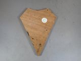 a small piece of wood with a sticker on it