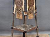 a wooden chair with a decorative design on the back