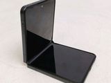 a black cell phone that is sitting on a table
